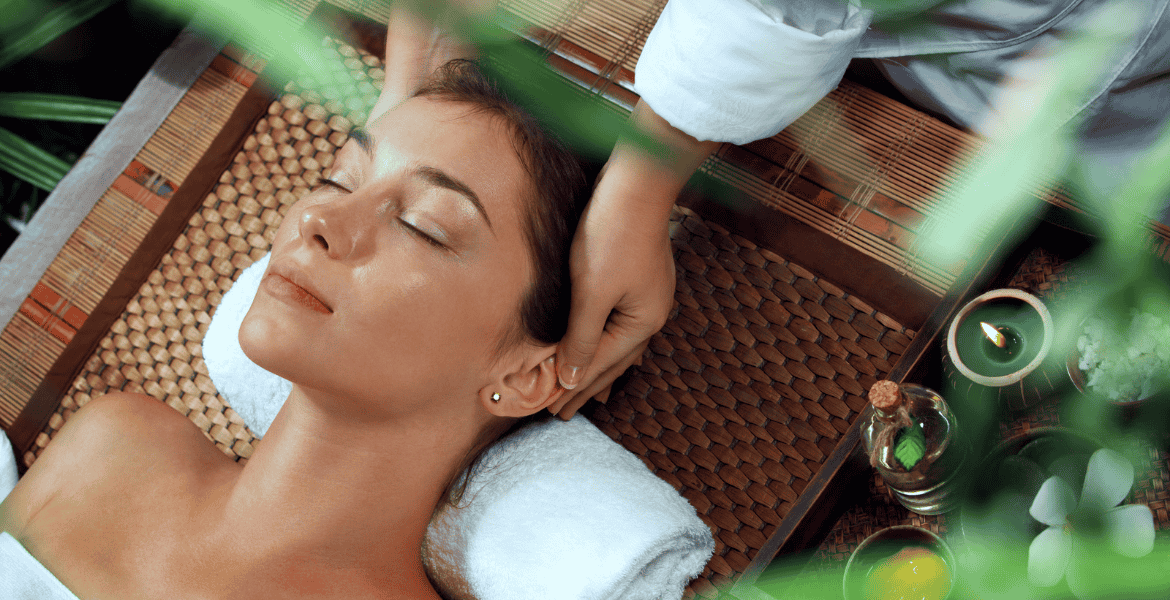 A skilled therapist gives a tourist a massage in a relaxing natural setting at a resort in Ella, Sri Lanka.